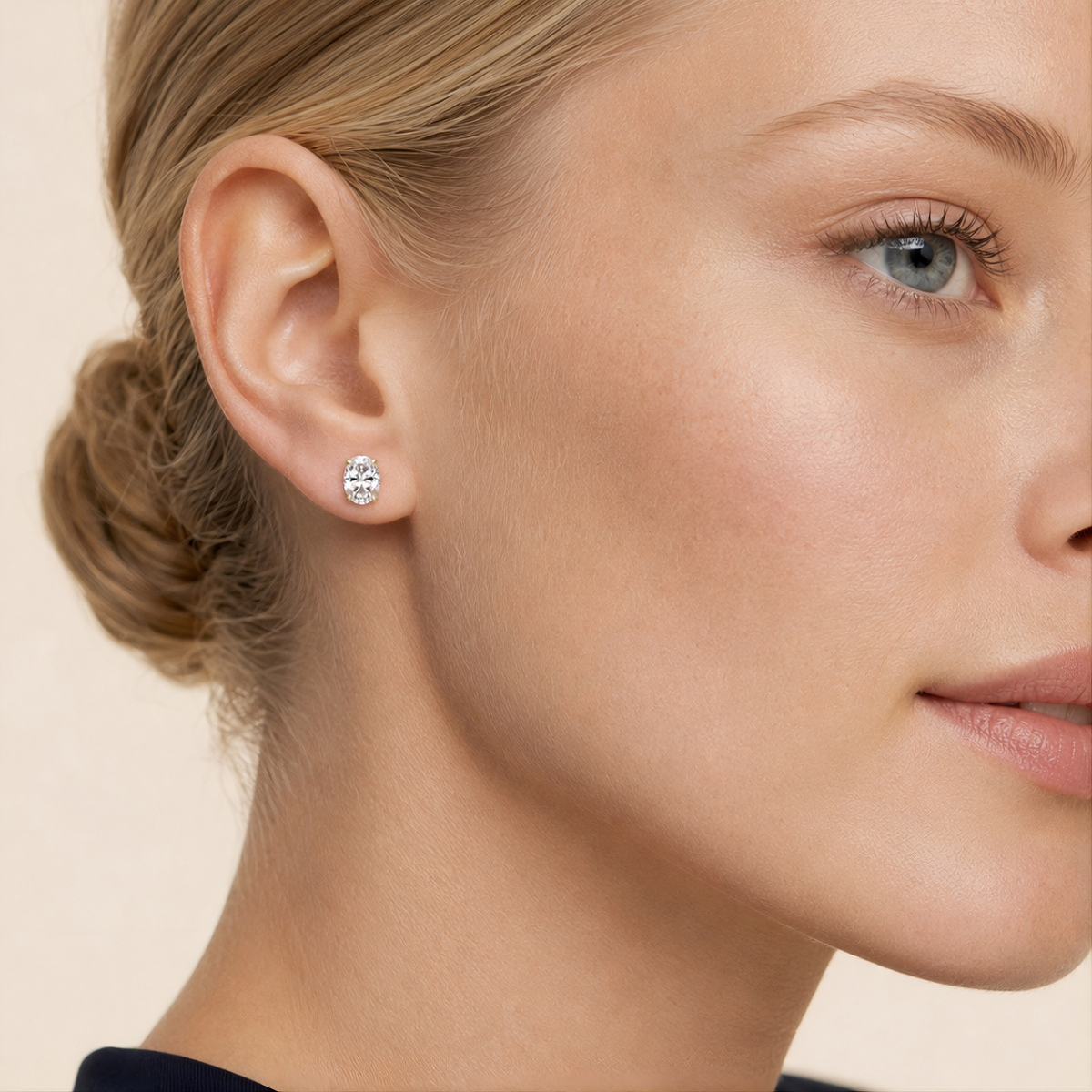 Balmante oval cut stud earring worn on the ear