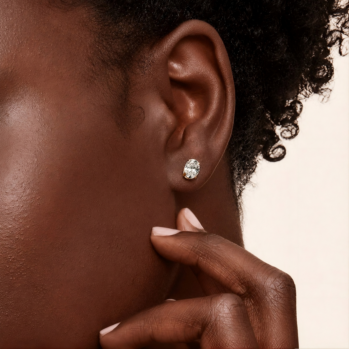 Close-up of a Balmante oval cut stud earring worn on the ear